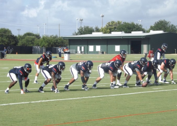 The Houston Texans practice in full pads while absorbing the temperature of 98 degrees.