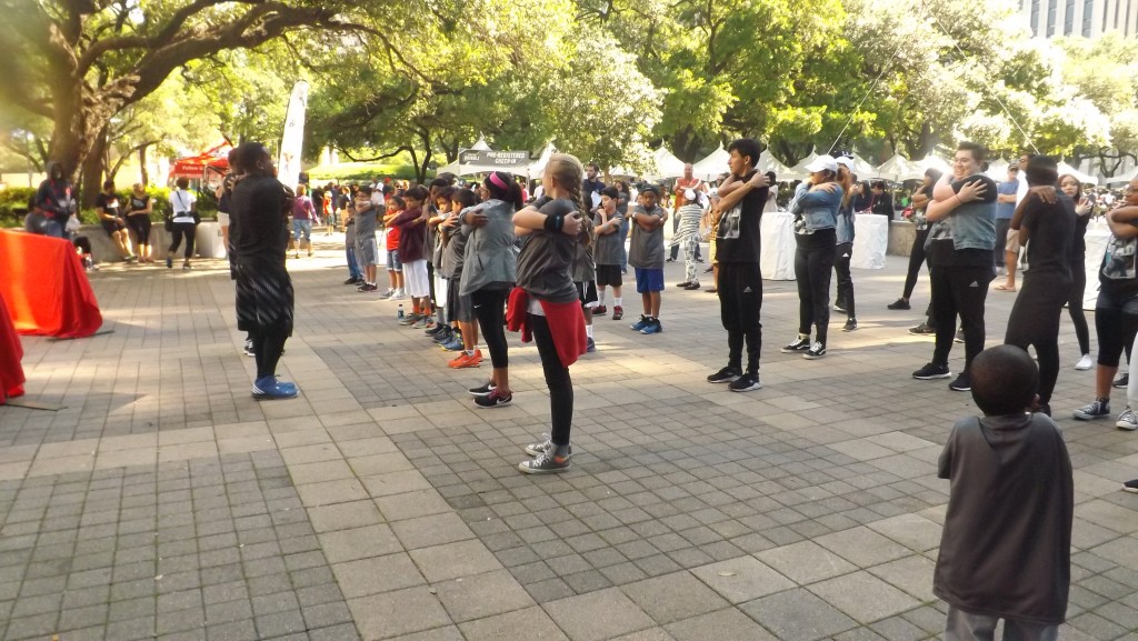 Participants warm-up before the Dribble begins.