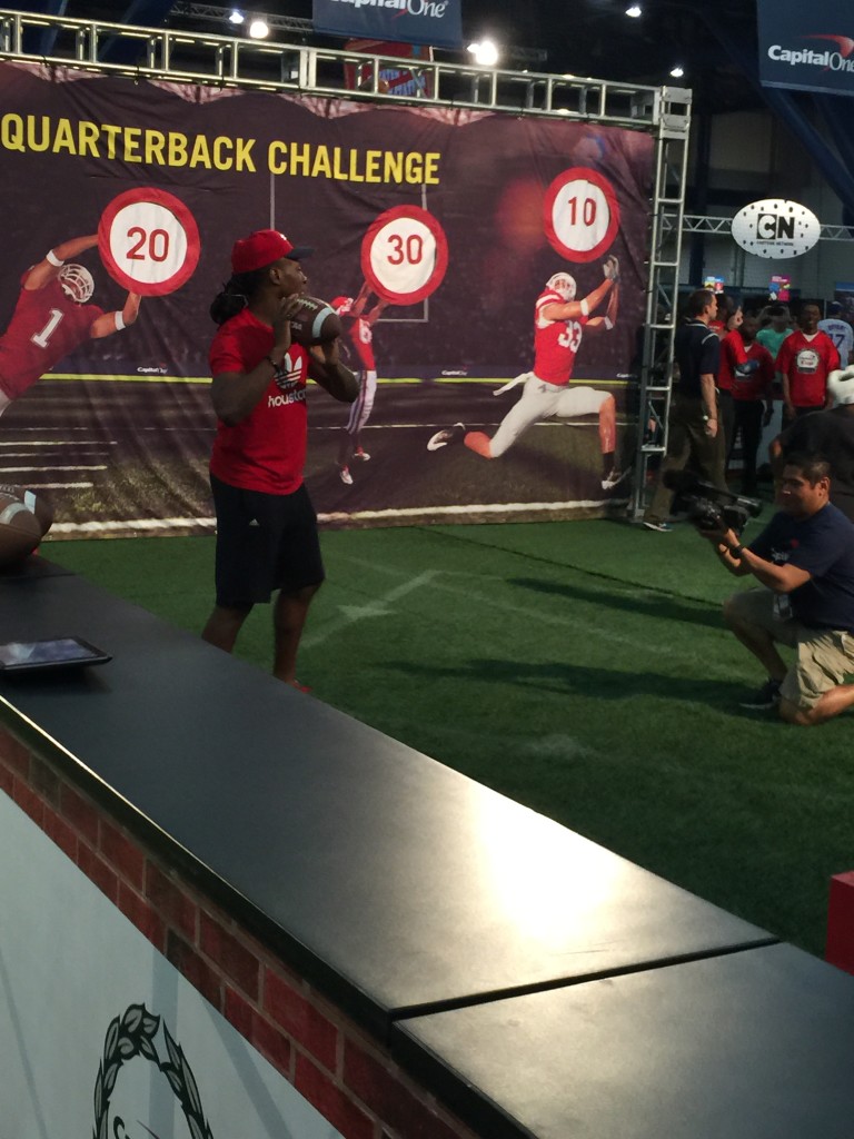 Houston Texans wide receiver Deandre Hopkins playing with participants during the Capital One Quarterback Challenge. His leg muscles look amazing. He is also my favorite Texans player. I ❤️ him.